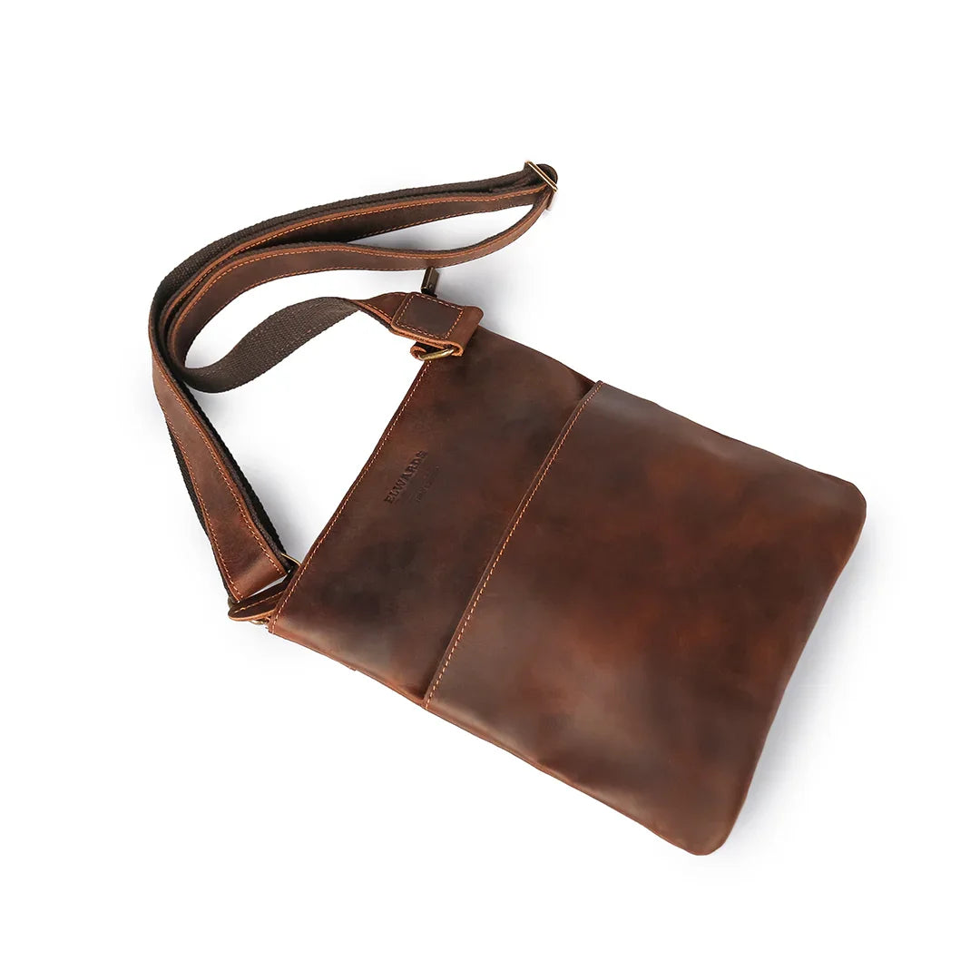 Angled top view of brown crossbody leather bag showing its minimalistic yet practical design and durable Crazy Horse leather.