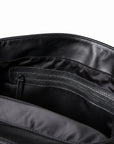 Interior zip pocket in full-grain leather backpack