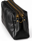 Black leather pouch with gold-tone zippers and hardware.
