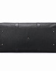 Black textured leather travel bag shown from the back, featuring a pebbled finish, silver-tone metal studs, and a zippered closure on a white background.