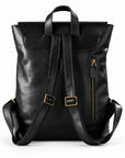 Black leather backpack with gold-tone hardware, shown from the back.