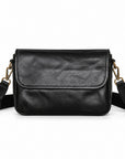 Black leather crossbody bag with a flap closure and adjustable shoulder strap.