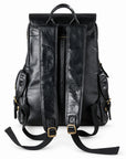 Black leather backpack shown from the back, featuring dual top handles, adjustable shoulder straps with gold-tone buckles, and side zippered pockets.