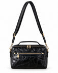 Black leather crossbody bag with gold-tone hardware, featuring a top handle, a shoulder strap, and multiple zippered compartments.