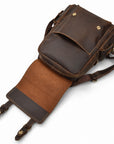 A dark brown leather messenger bag with a front flap pocket and a detachable shoulder strap.