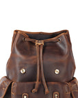 Brown leather backpack with drawstring on a white background