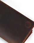Brown leather wallet with a brand logo on a white background