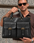 Business black leather laptop bag for men with dual front flap pockets, buckle details and padded carry handles