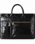 Classic black full-grain leather briefcase with rounded handles, a front flap pocket and zip pocket