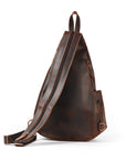 Brown leather sling bag on a white background
