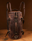 Front view of a handmade vintage leather backpack with adjustable straps, ideal for travelers and daily commuters