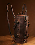 Front view of a vintage handmade leather backpack, showcasing spacious compartments for essentials and travel gear
