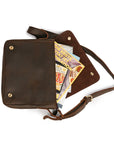 Interior of a vintage leather messenger bag with compartments for books, documents, and a 13-inch laptop