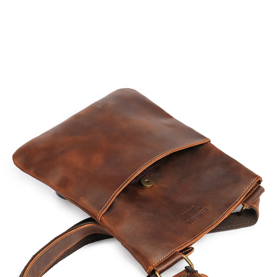 Top view of the bag's magnetic closure, featuring soft Crazy Horse leather and durable hardware for secure functionality.