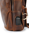 Men’s brown leather sling bag side view with USB port