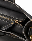 Men's black full-grain leather tote bag top zipper with a leather pull and contrast stitching