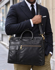 Professional black leather laptop briefcase for men with top handles, front zipper pocket, flap pocket and detachable shoulder strap