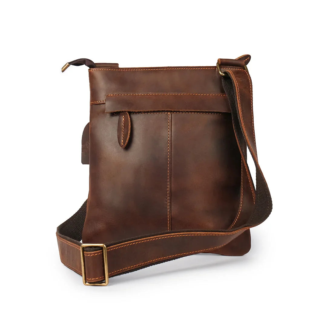 Rear view of a brown leather bag with adjustable strap, highlighting versatility and Crazy Horse leather craftsmanship.