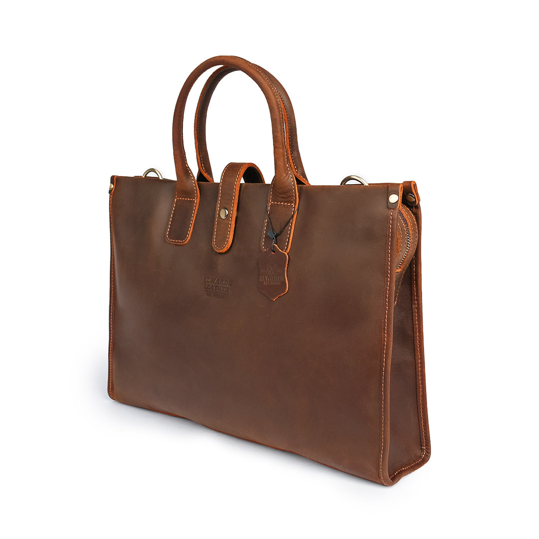 Elegant brown classic leather bag with sturdy handle and vintage design, side view.