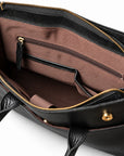 The black full-grain leather briefcase interior shows brown lining, a zipped wall pocket and two black-trimmed slip pockets.