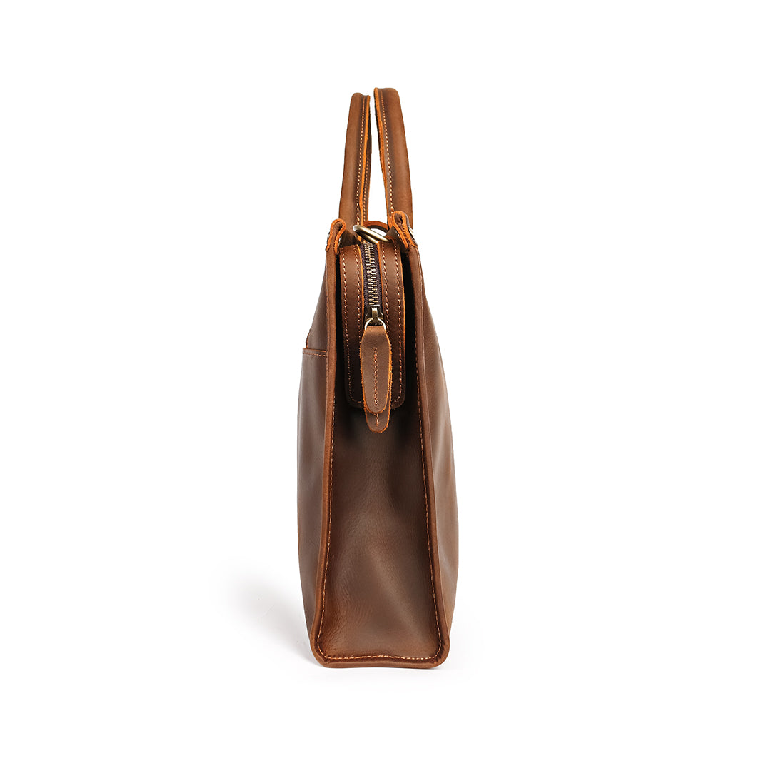 Side view of a slim handmade work bag made from Crazy Horse leather, featuring an additional zippered compartment.