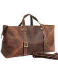 Spacious vintage brown duffle bag with a detachable shoulder strap, made from full-grain Crazy Horse leather.