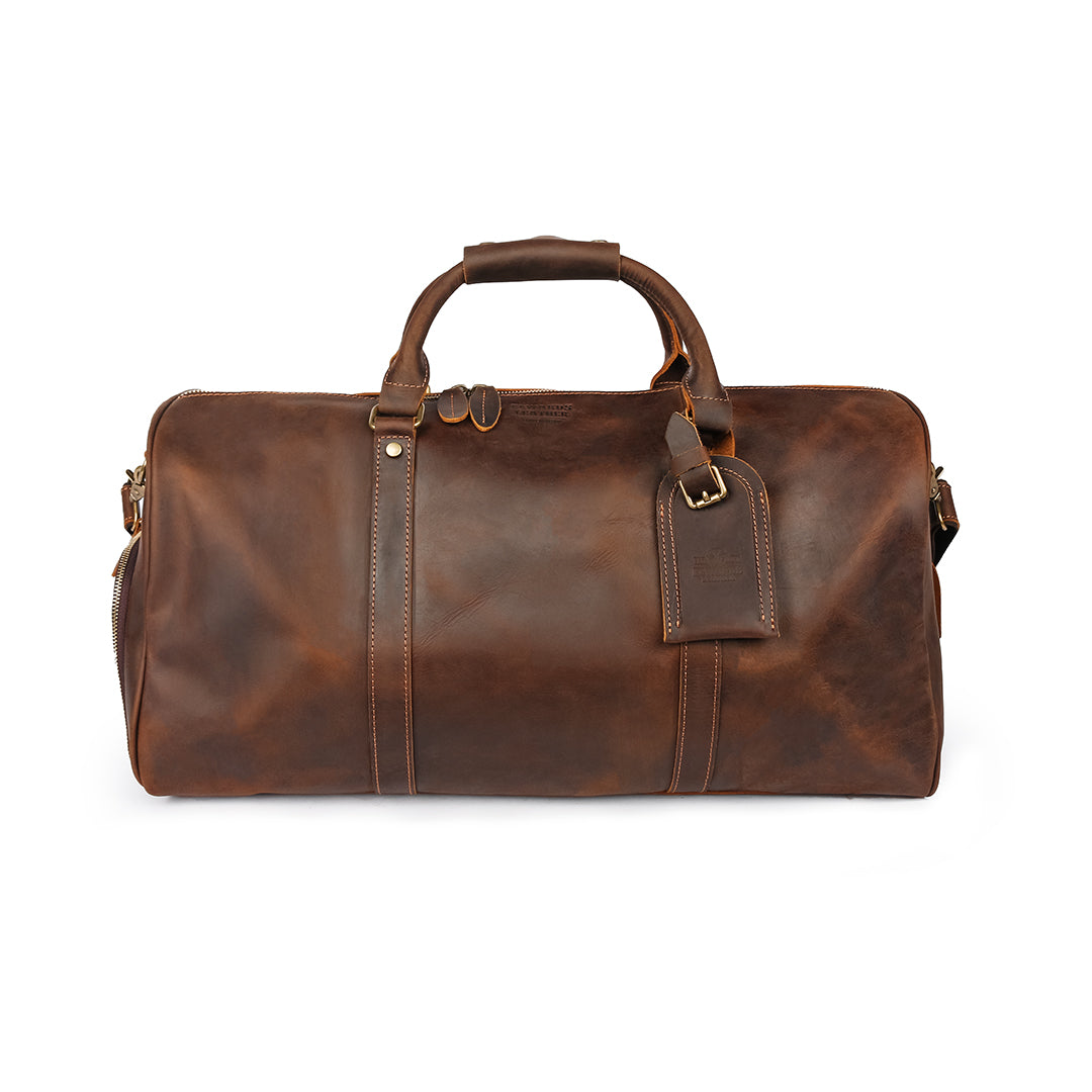 Vintage-inspired leather duffle bag with rich brown Crazy Horse leather and sturdy handles, perfect for travel.