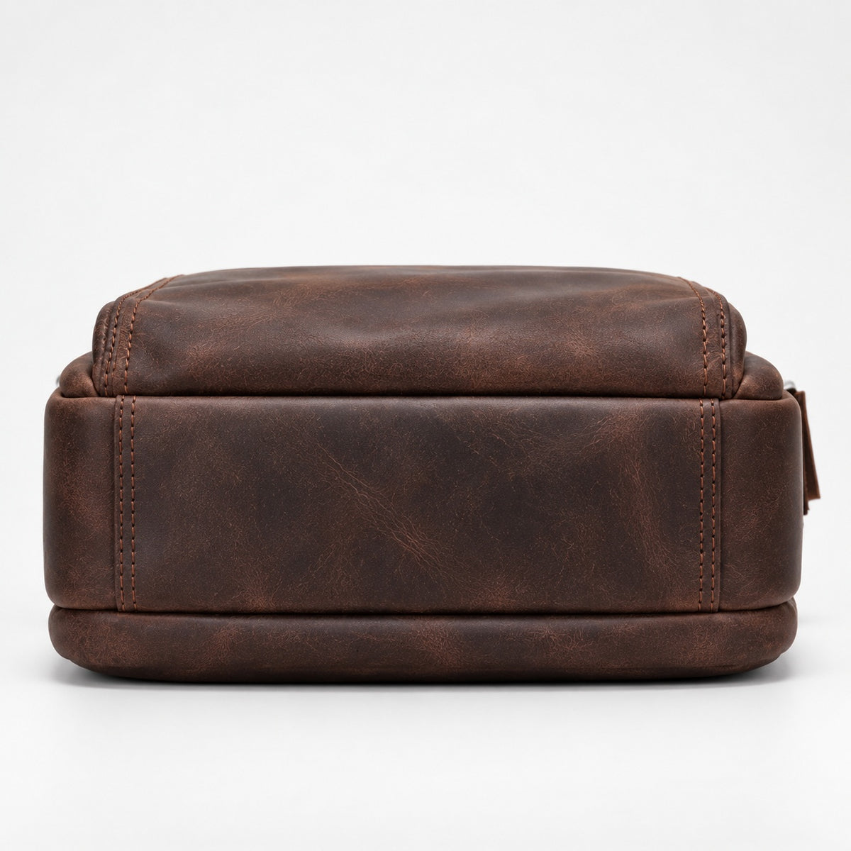 A dark brown distressed leather rectangular pouch or small bag, shown from the front against a clean white background.