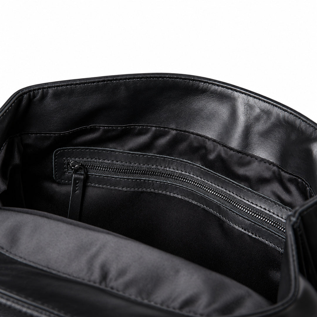 Interior zip pocket in full-grain leather backpack