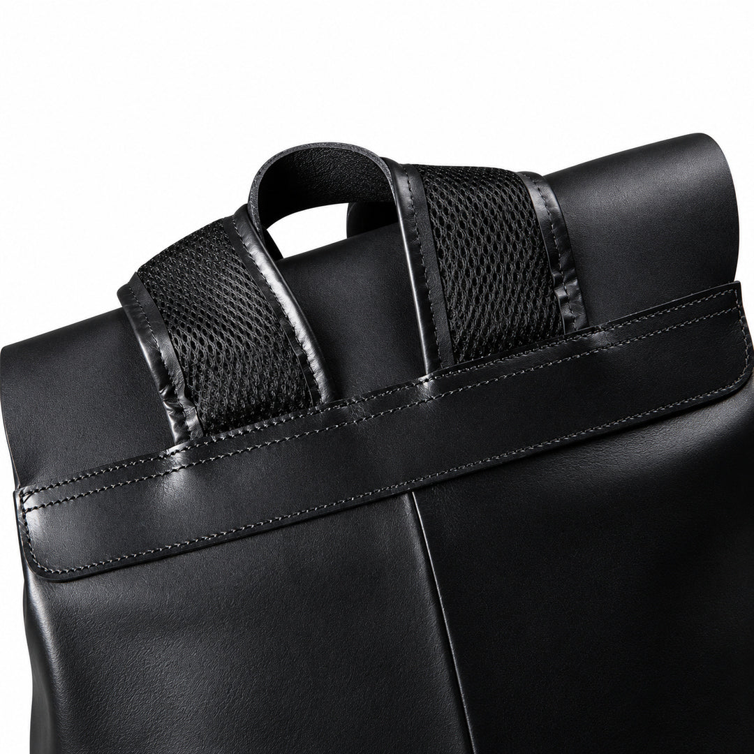 Mesh-lined shoulder straps on full-grain leather backpack