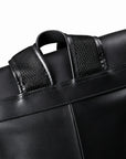 Mesh-lined shoulder straps on full-grain leather backpack