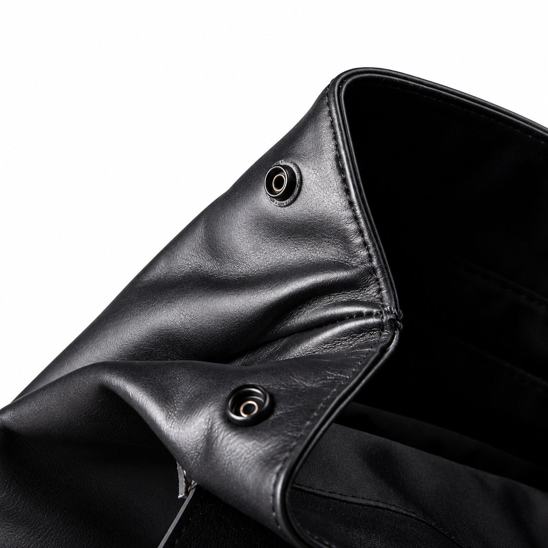 Side snap closure on full-grain leather backpack