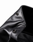 Side snap closure on full-grain leather backpack