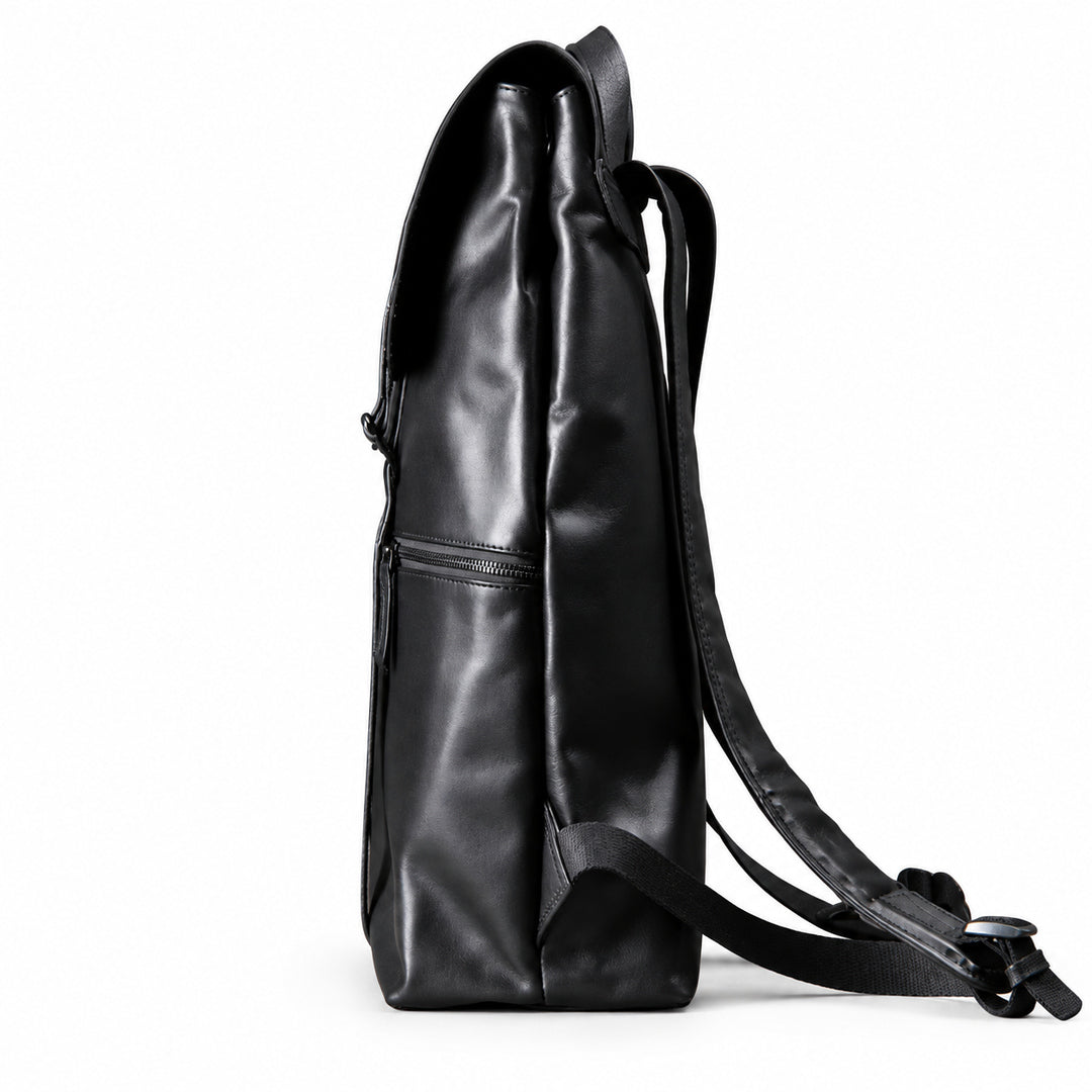 A black full-grain leather backpack shown from the side profile against a clean white background.