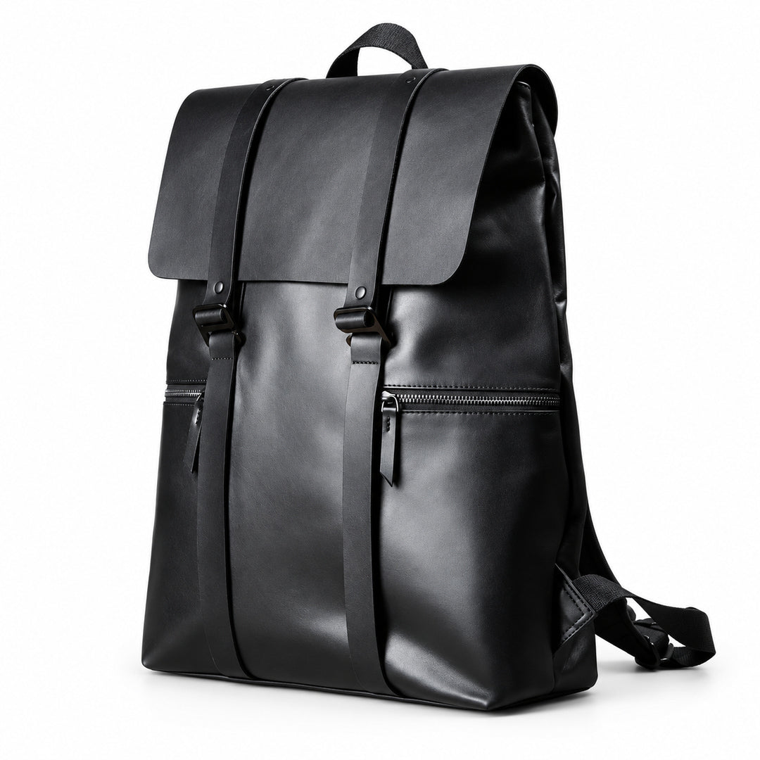 A black full-grain leather backpack with a top flap, two vertical front straps, a front zippered pocket, and a top carry handle.