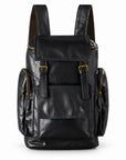 Black full-grain leather backpack with a front flap, twin buckles and stitched front pocket