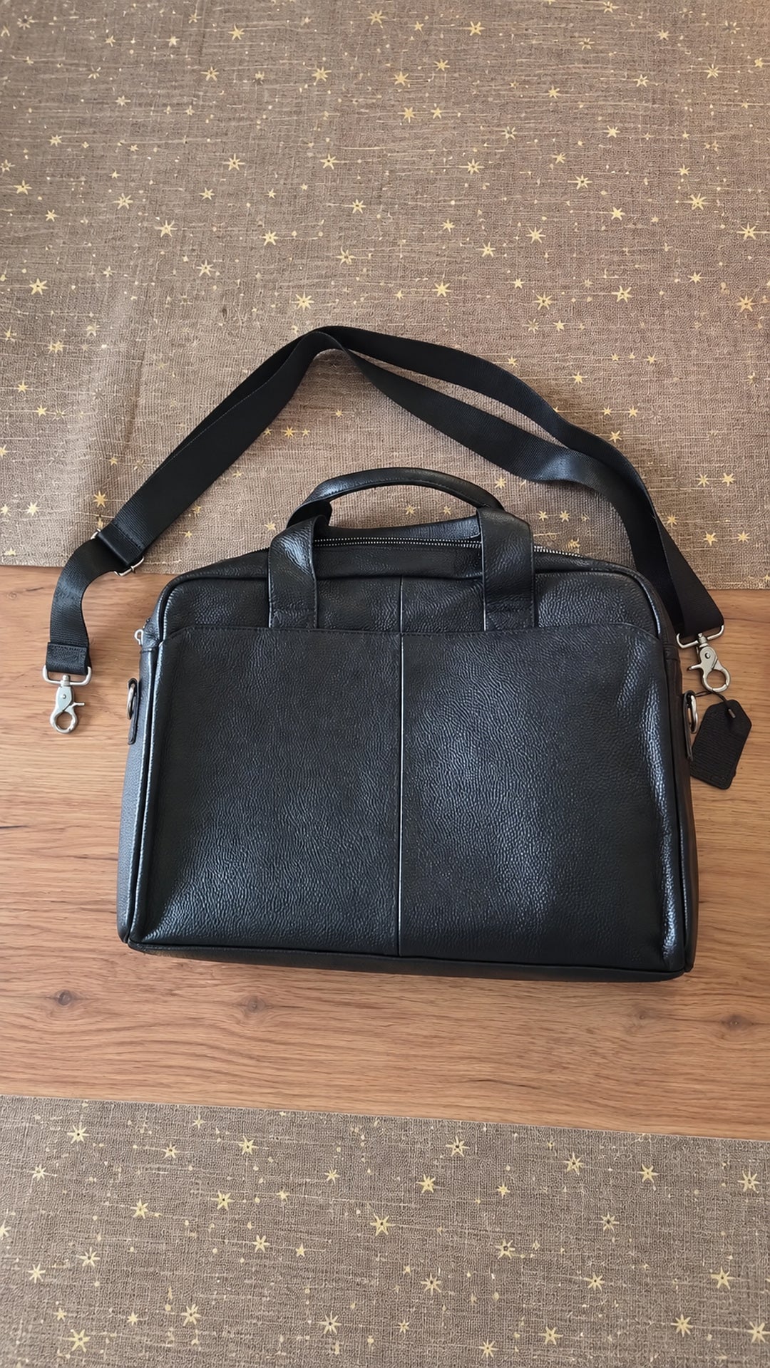 black leather briefcase for men layin the floor