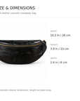 Black leather crescent crossbody bag with gold-tone zipper hardware.