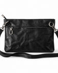 Black leather crossbody bag with a front zip pocket, silver-tone hardware, and an adjustable shoulder strap.
