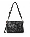 A black textured leather shoulder bag with a crinkled finish, featuring a long adjustable shoulder strap, a wristlet strap, and silver-tone hardware.