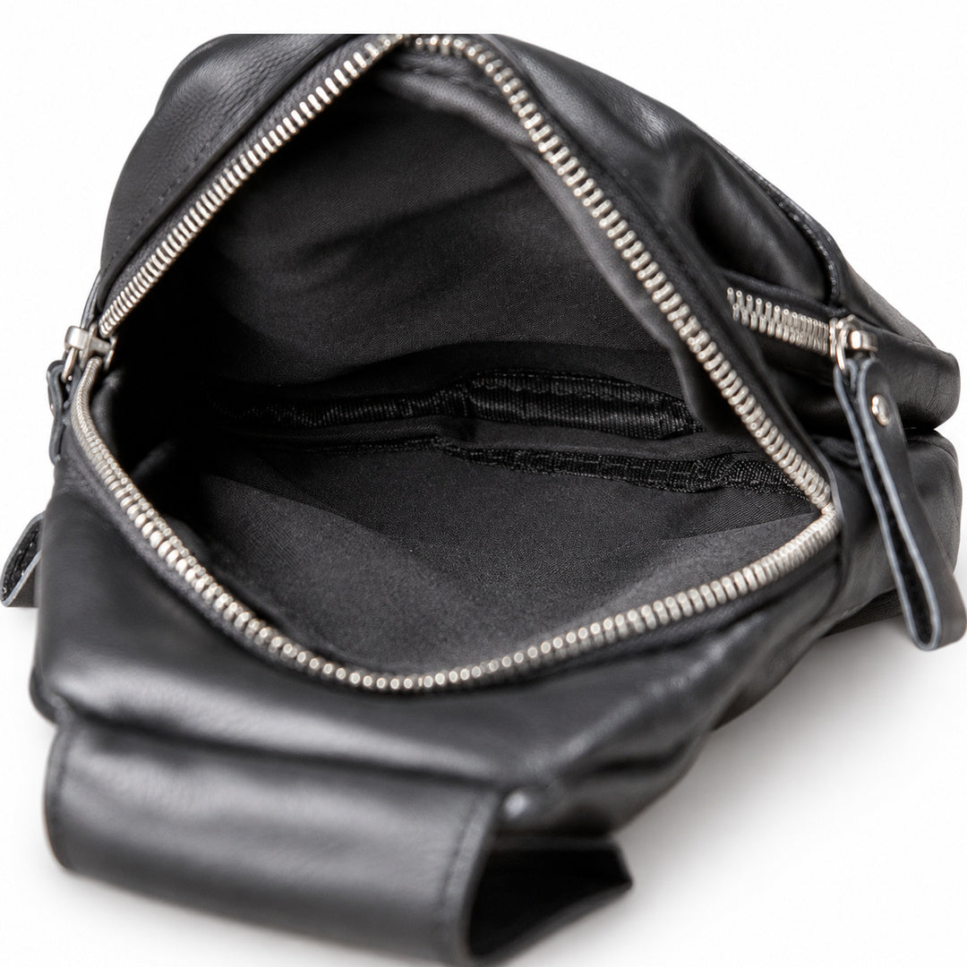 Black leather crossbody bag shown open to display the interior, featuring silver-tone metal zippers and a black fabric lining.