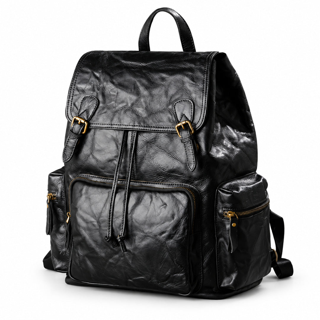 A black crinkled leather backpack with gold-tone hardware, shown on a clean white background.
