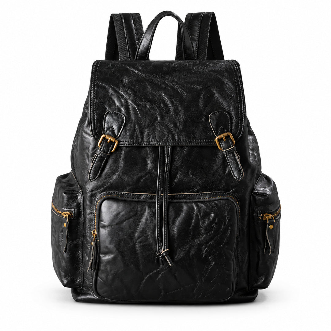 A black distressed leather backpack with gold-tone hardware, shown against a plain white background.
