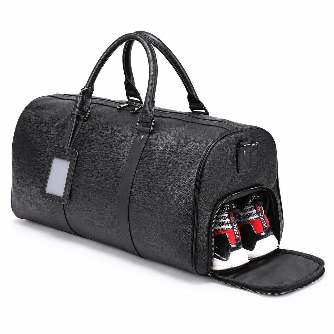A black pebbled leather duffel bag with dual top handles, a luggage tag, and an open side compartment showing two red and white beverage cans inside, set against a plain white background.