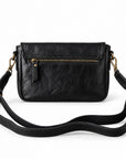 Black leather crossbody bag with a front zip pocket and a long adjustable shoulder strap.