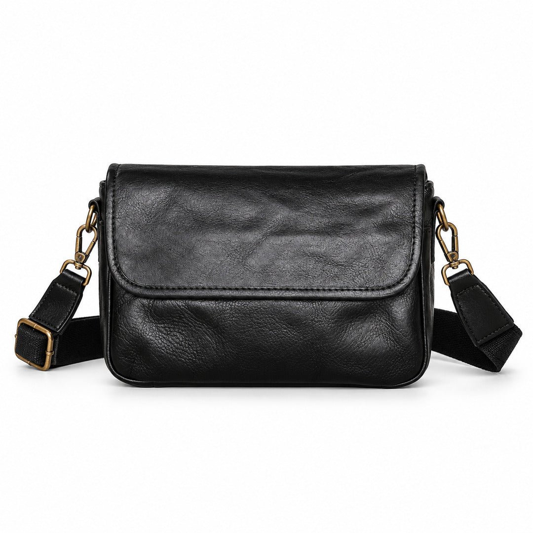 Black leather crossbody bag with a flap closure and adjustable shoulder strap.