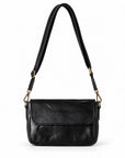 A black leather crossbody handbag with a front flap and an adjustable shoulder strap.