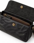 Black leather crossbody handbag with an open flap, showing a brown interior zippered pocket and gold-tone hardware.