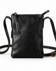Black leather crossbody bag with a top zipper, front zipper pocket, and adjustable shoulder strap on a white background.