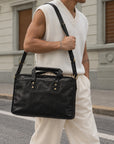 Black leather work briefcase for men with carry handles, adjustable shoulder strap and spacious laptop compartment